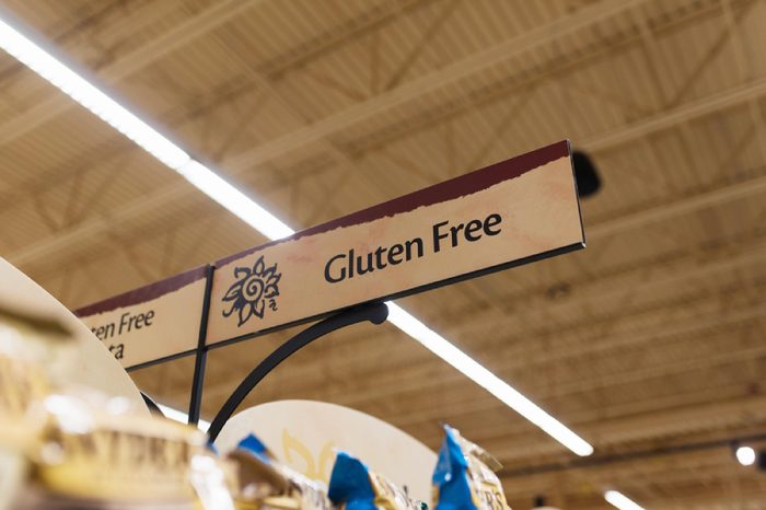 BOSTON, MASSACHUSETTS - MAY 25, 2017: Wegman's gluten free products, snacks, and ingredients for people with Celiac Disease and wheat allergies/sensitivities. Grocery store gluten free section sign