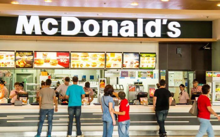 BUCHAREST, ROMANIA - SEPTEMBER 14: People buying fast-food from McDonald's Restaurant on September 14, 2012 in Bucharest, Romania. McDonald's is the main fast-food restaurant chain in Romania.