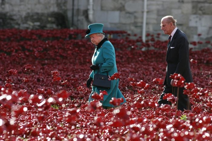 LONDON - OCT 16, 2014: Her Majesty The Queen and the Duke of Edinburgh visit the Tower of London to view the poppy display commemorating the centenary of the outbreak of World War I
