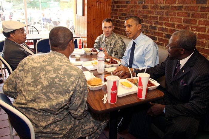 President Barack Obama having lunch with members of the armed services and local barbers at Kenny's BBQ on Capitol Hill in celebration of Father's Day, Washington DC, America