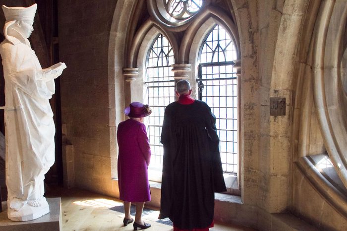 Queen Elizabeth II is shown around the Gallery by The Very Reverend John Hall.