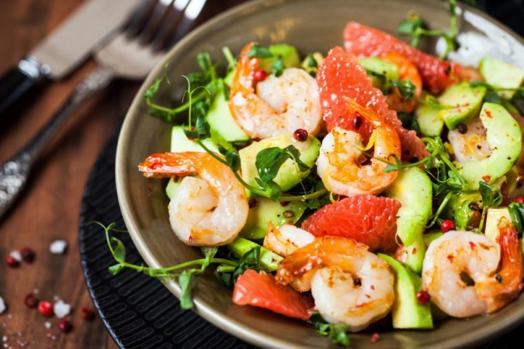 Delicious fresh salad with prawns, grapefruit, avocado, cucumber and herbs