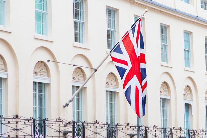 British flag flying on the balcony of a historic building in central London