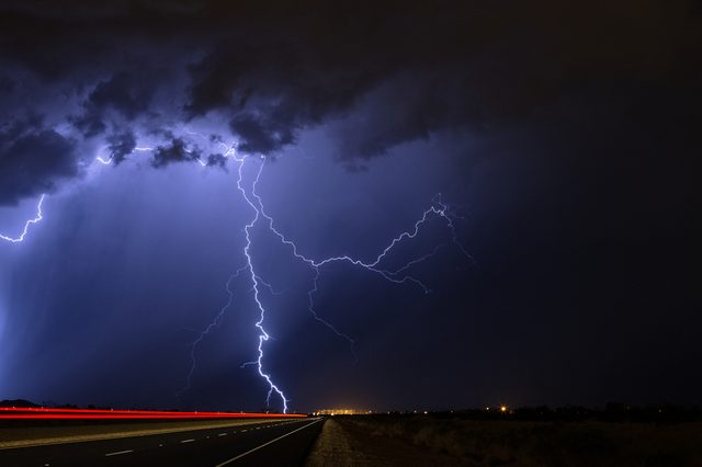 Lightning strikes during a nighttime thunderstorm.