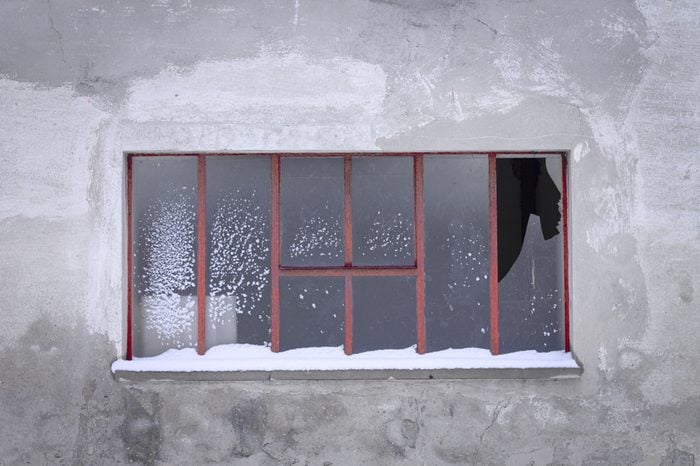 Isolated broken window with snow (Pesaro, Italy)