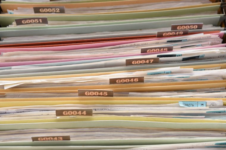 Important documents arranged in a file placed in a filing cabinet.