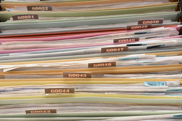 Important documents arranged in a file placed in a filing cabinet.