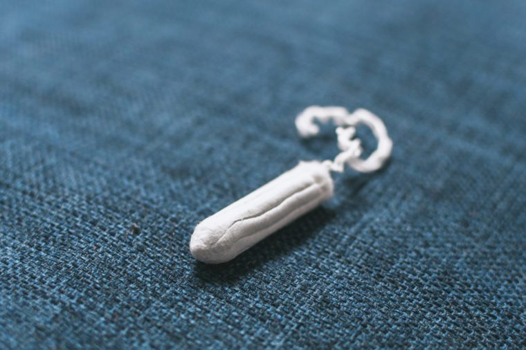 A tampon against the blue background