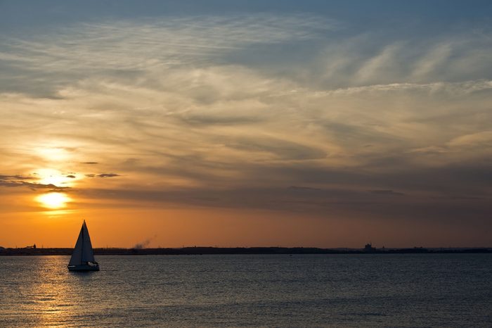 A sailboat on the Chesapeake bay in Maryland at sunset