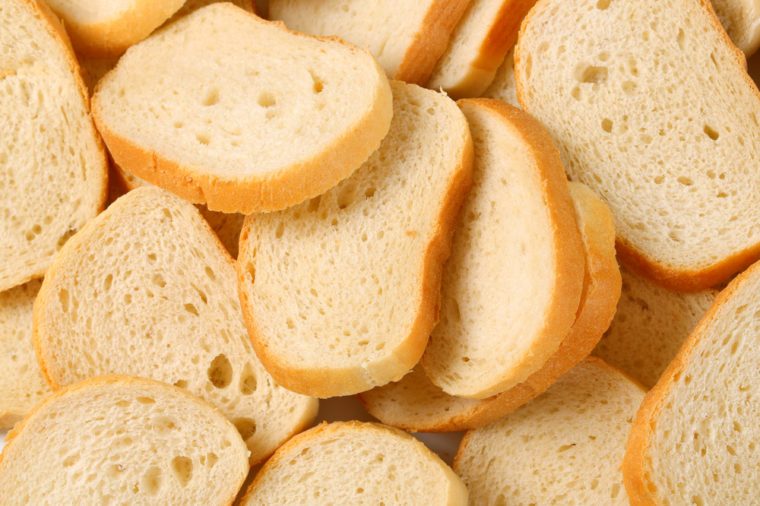 Slices of white bread on white background