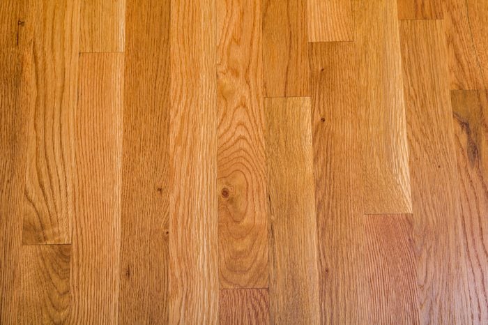 A shiny, polished hardwood floor for background or texture