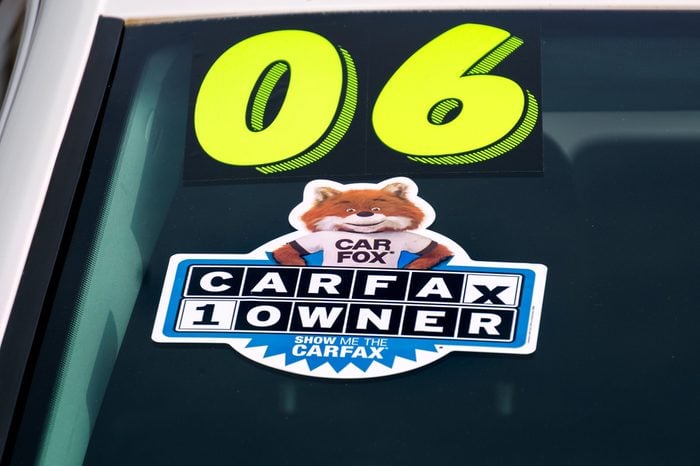 PASADENA, CA/USA - JANUARY 16, 2016: CARFAX decal on used automobile for sale. Carfax, Inc. is a service that supplies vehicle history reports.