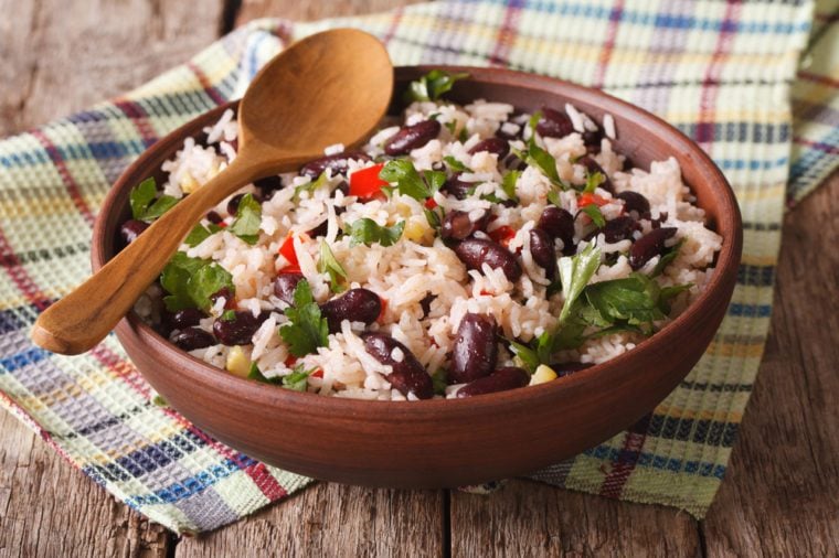 Healthy food: rice with red beans in a bowl close-up on the table. horizontal
