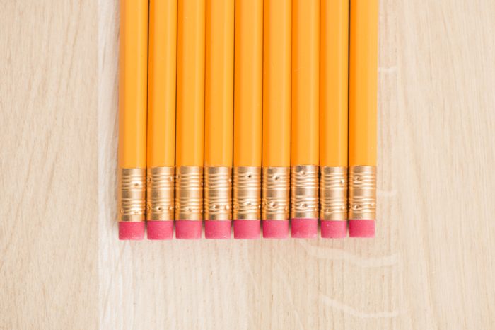 Close up of yellow pencils on wooden table. Concept of office work, writing and education.