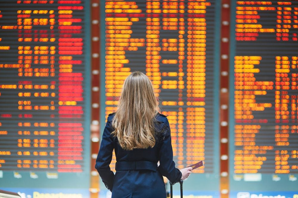 Woman looking at airline flight times
