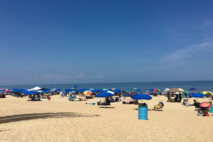 REHOBOTH BEACH, DE - JULY 31, 2016: People enjoying a warm summer day at Rehoboth Beach. Rehoboth beach is a popular beach in Delaware.