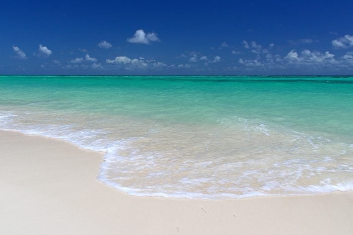 The pristine sands and crystal clear waters of Cable Beach, Nassau in the Bahamas.
