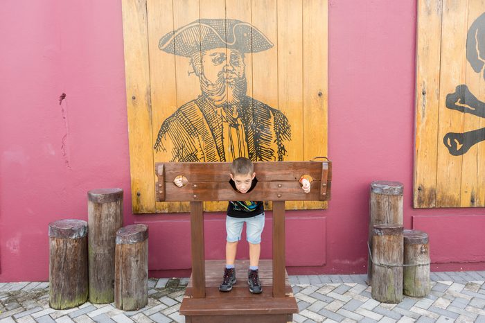 NASSAU, BAHAMAS - OCT 15, 2016: People in the Pirates of Nassau Museum, a small museum documenting the city's history as 18th-century pirate base, with replica pirate ship & exhibits.