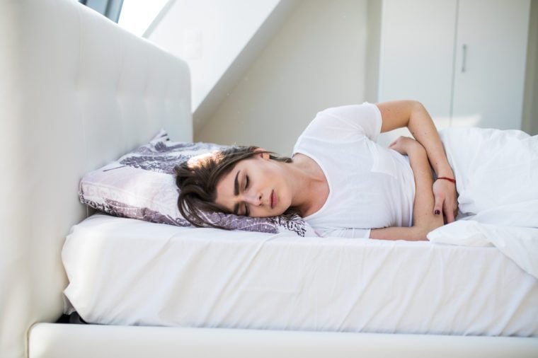 menstruation pain or stomach ache on bed