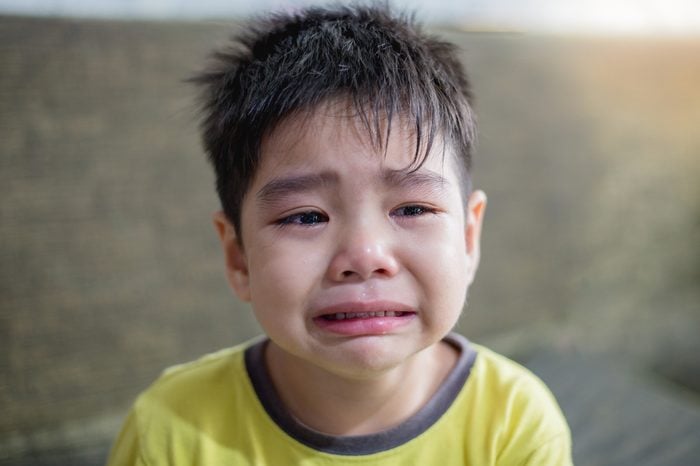 The asian boy crying. Chinese boy is sad. 