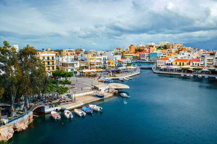 The lake Voulismeni in Agios Nikolaos, a picturesque coastal town with colorful buildings around the port in the eastern part of the island Crete, Greece