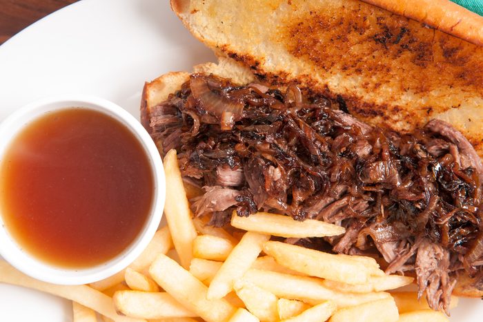 classic french dip au jus or beef dip with fries and sauteed onions take away