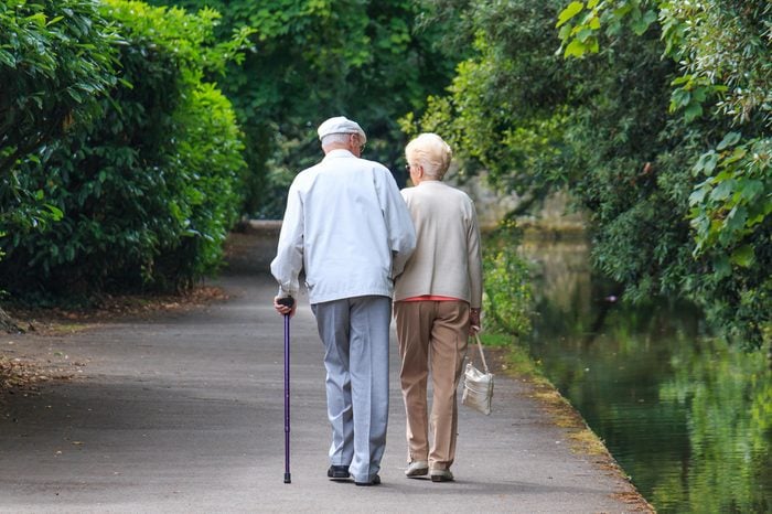  old couple walking in the park 