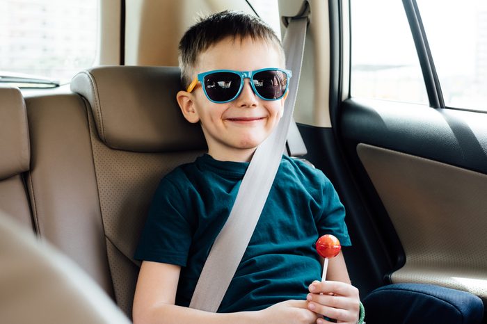 Child in the car with fasten seat belt 