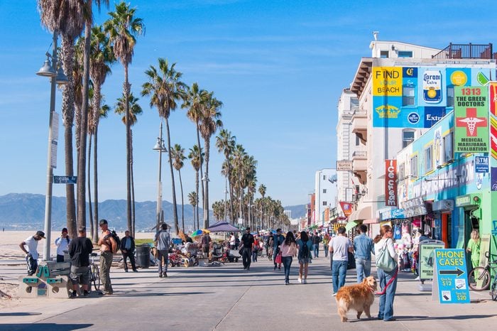 People were walking on street among local shops at Venice Beach, California, U.S.A. This was taken on Nov 19, 2015.