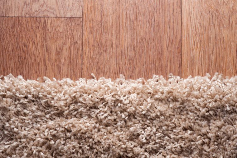closeup of brown carpet on a wood surface