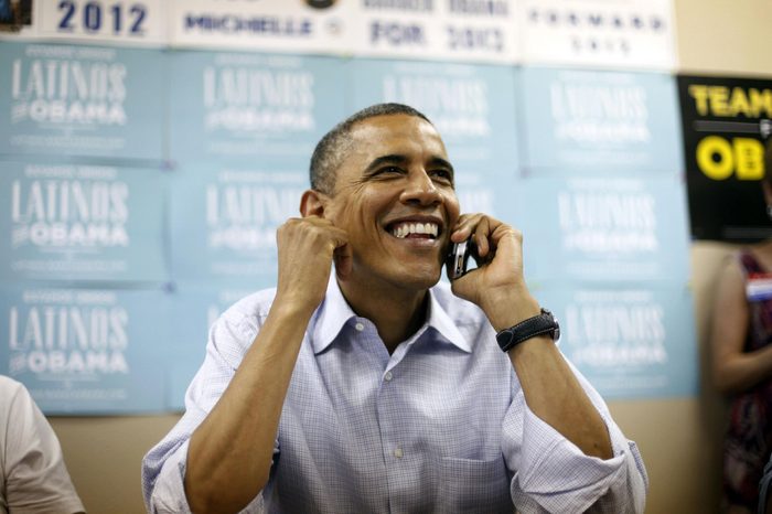 Barack Obama President Barack Obama uses a cell phone to call supporters during a visit to a local campaign office, in Henderson, Nev