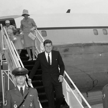 John Kennedy, JFK, Jacqueline Kennedy President John F. Kennedy leaves his plane at Otis Air Force Base, Mass.,, for a long weekend holiday at his nearby Hyannis Port home. Mrs. Jacqueline Kennedy walks down the ramp hand-in-hand with daughter Caroline. Nurse Maud Shaw carries John Jr., in the background