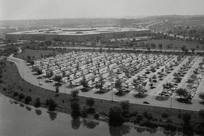 View of the grounds showing parked cars around the Pentagon building (in background) in Arlington, Virginia on