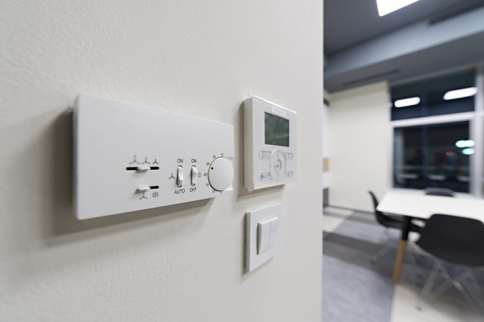 Climate control on office wall, selective focus