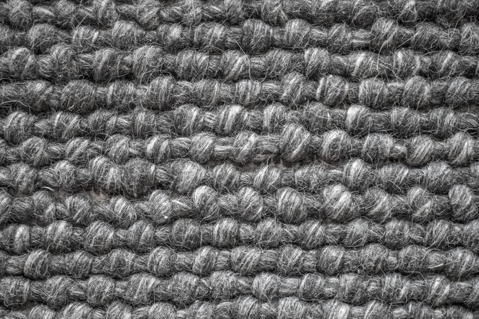 Close up of a wool carpet. Black and White texture. Modern design.
