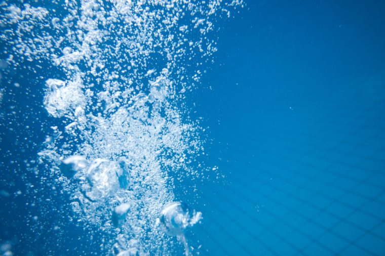 Air bubbles in clear blue water in pool (underwater shot), good for backgrounds