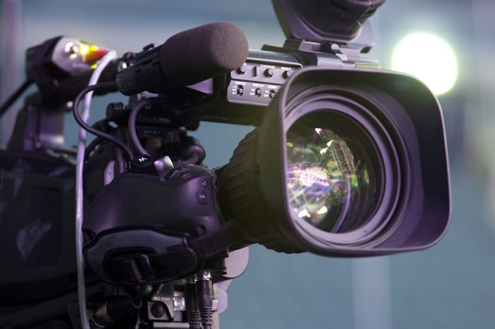 Professional digital video camera. accessories for 4k video cameras.tv camera in a concert hall.