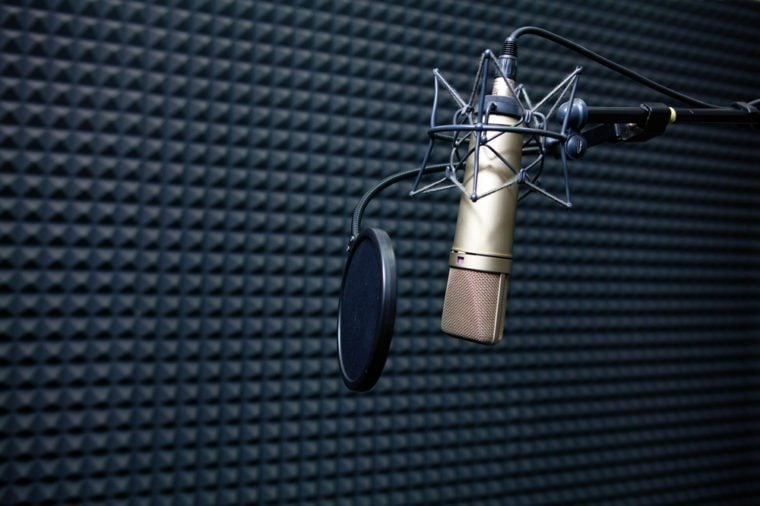 Studio recording microphone near wall with acoustic dampening foam