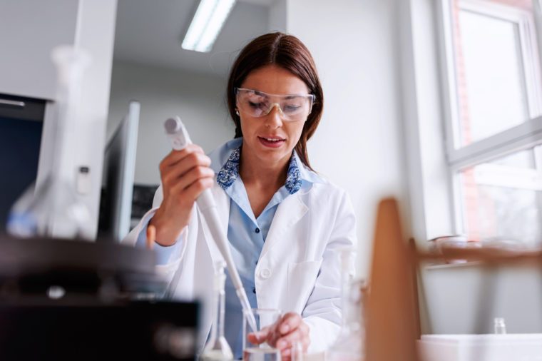 Woman scientist in laboratory doing chemical tests