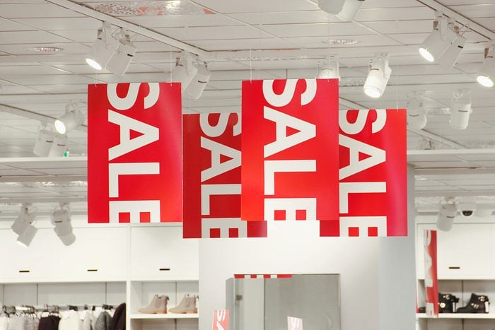 Sale signs in a clothing store.