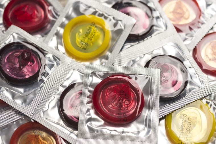 Close up shot of various colored condoms