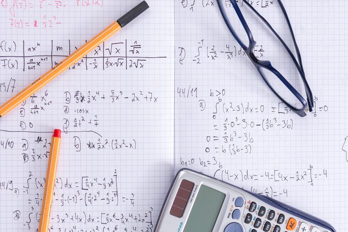 Maths school homework exercise book glasses calculator pens