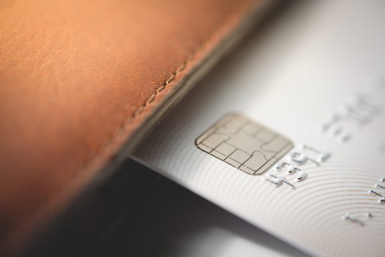 Credit cards in brown wallet with shallow focus, toned picture