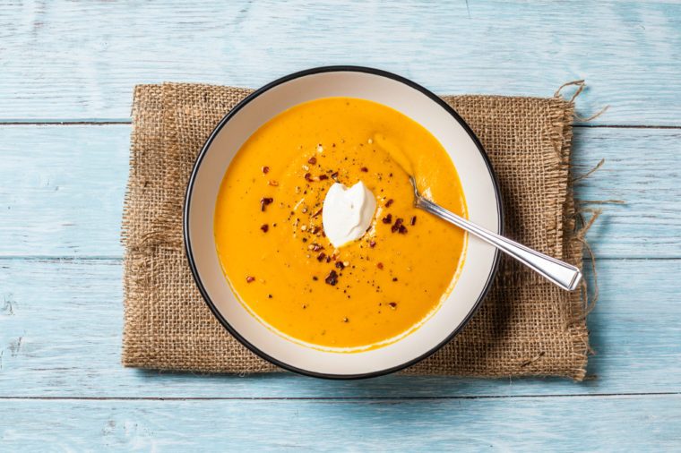 Homemade butternut squash and chilli soup. Served with a dollop of creme fraiche, seasoned with chilli flakes and black pepper