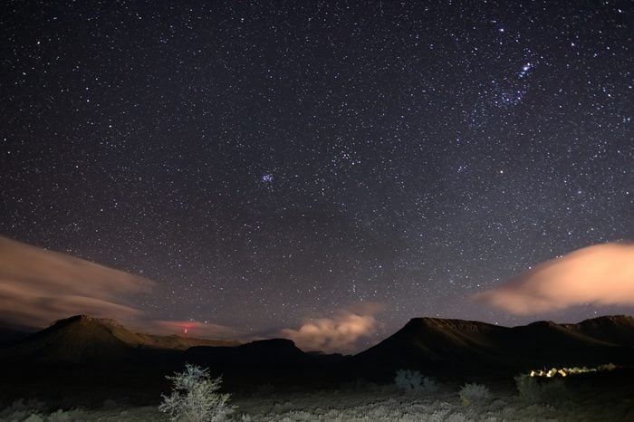 The starry sky captured Karoo National Park, South Africa, in winter. The Pleiades star cluster, Orion and Taurus Constellation clearly visible.