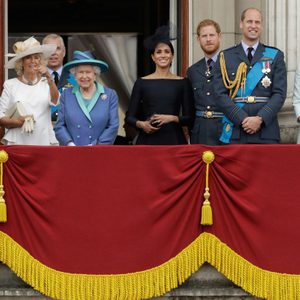 Members of the royal family gather on the balcony of Buckingham Palace, with from left, Prince Charles, Camilla the Duchess of Cornwall, Prince Andrew, Queen Elizabeth II, Meghan the Duchess of Sussex, Prince Harry, Prince William and Kate the Duchess of Cambridge, as they watch a flypast of Royal Air Force aircraft pass over Buckingham Palace in London, . Various events were held Tuesday to mark 100-years since the formation of the RAF