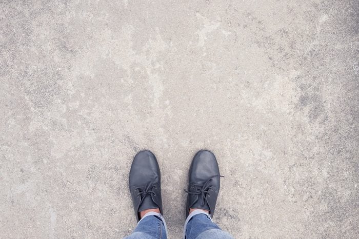 top view selfie of fashion jeans and leather shoes on concrete background