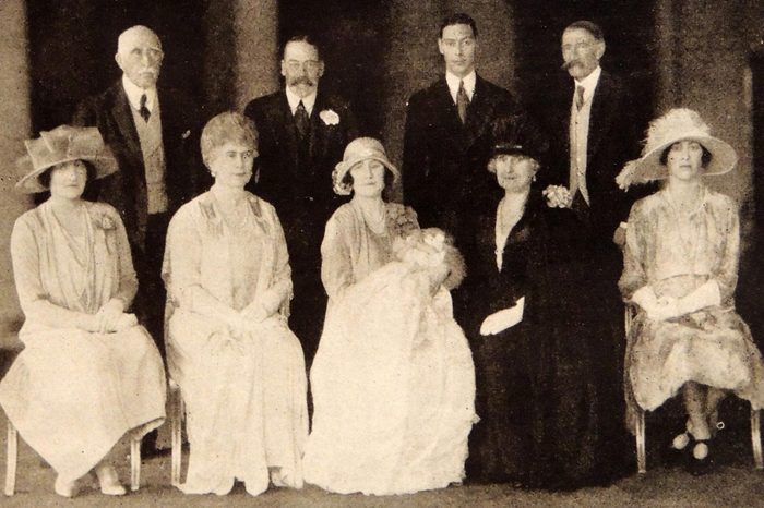 Photograph taken during the Christening of Princess Elizabeth Alexander Mary (1926- Present). Back row (L to R) Duke of Connaught, HM King George V, Duke of York, Earl of Strathmore. Front row (L to R) Lady Elphinstone, HM Queen Mary, Duchess of York and baby, Countess of Strathmore, Princess Mary, and Viscountess Lascelles. 1926