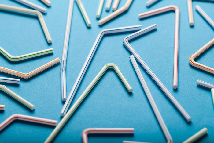 Plastic straws on a blue background