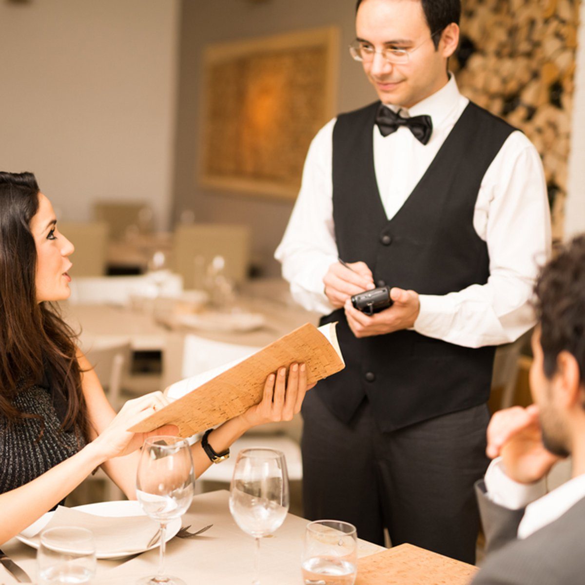 Couple ordering dinner in a luxury restaurant